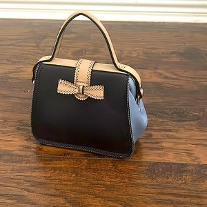 It is a small purse that is 9 inches long and 11 inches high.